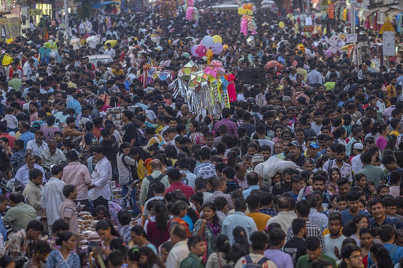 People crowd a market as they shop ahead of Diwali festival in Mumbai, India, Sunday, Nov. 5, 2023. (AP Photo/Rafiq Maqbool)