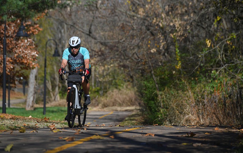 A cyclist rides south along the Razorback Greenway Wednesday, Nov. 8, 2023, near  Gordon Long Park in Fayetteville. Fayetteville was selected as the only city in the United States to test out the CycleRAP program, which uses photos and data to determine the most dangerous spots on the cityâ€™s trail system in terms of potential rider crashes. Visit nwaonline.com/photo for today's photo gallery.
(NWA Democrat-Gazette/Andy Shupe)