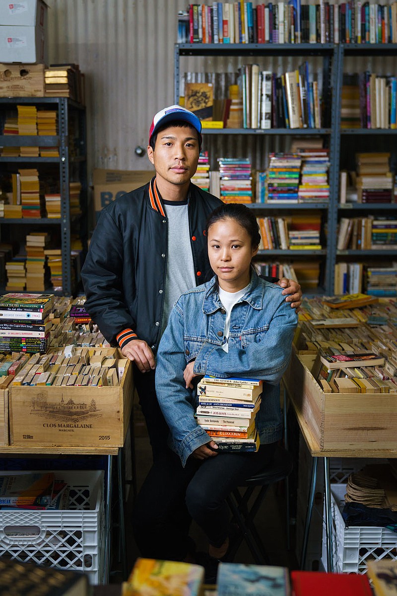 On The Cover:

Part of Sam Comens “Working America” exhibit, on show at the Rogers Historical Museum, is this portrait of Chris Capizzo and Jenny Yang, who are booksellers. “When my mom immigrated with her parents, it was about survival in a foreign place,” Capizzo says. “My grandfather was a radiologist, and he came and opened a truck stop, making hamburgers. Jennys parents ended up opening a liquor store, a fish market, a supermarket. Theoretically, they did that so that we wouldnt have to do those things. I think for us, its about survival as well.”

(Courtesy Image/ExhibitsUSA via Rogers Historical Museum)