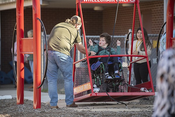 Wheelchair swing provides fun for special needs students at Springdale elementary schools