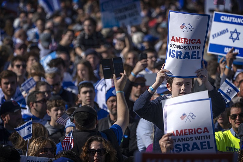 Participants hold signs reading "America Stands with Israel" as they stand on the National Mall at the March for Israel on Tuesday, Nov. 14, 2023, in Washington. (AP Photo/Mark Schiefelbein)