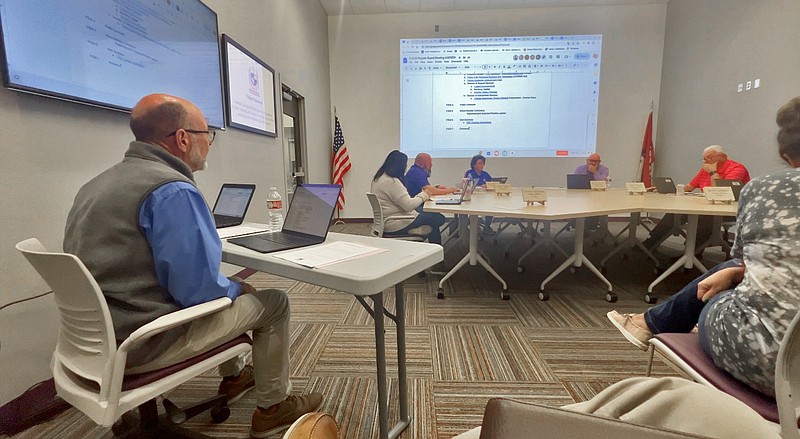 Fountain Lake School District Director of Instructional Services Steve Campbell, far left, comments during a public hearing held at the Nov. 13 board meeting regarding the termination of an elementary school teacher. (The Sentinel-Record/Brandon Smith)