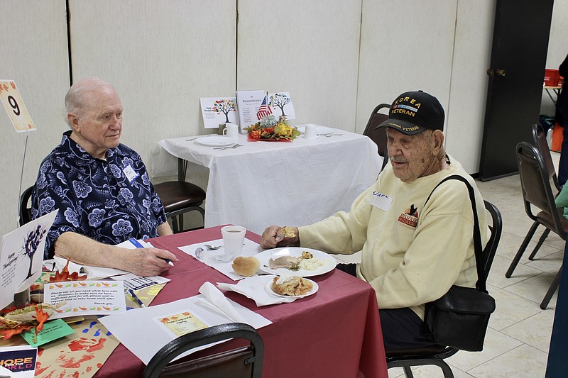 News Tribune file photo: 
Paul Vanhorn and Dave Kleindienst chat during the 2022 Thanksgiving meal at First Baptist Church in Jefferson City.