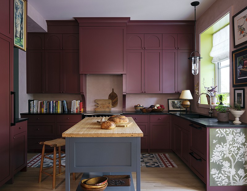 Designer and "Uncommon Kitchens" author Sophie Donelsons Montreal kitchen is homey and colorful. Donelson and other design experts say that with a measure of color, pattern and/or decor elements, we can all have a kitchen that serves up happy. (Patrick Biller via AP)
