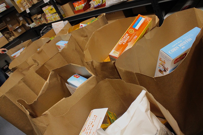 Food bags prepared by Interfaith Help Services volunteers are pictured in this 2022 News-Times file photo. Local food pantries are reporting increased need in the community.
