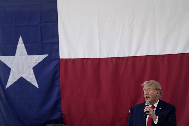 Republican presidential candidate and former President Donald Trump speaks to Texas state troopers and guardsmen at the South Texas International Airport Sunday, Nov. 19, 2023, in Edinburg, Texas. (AP Photo/Eric Gay)
