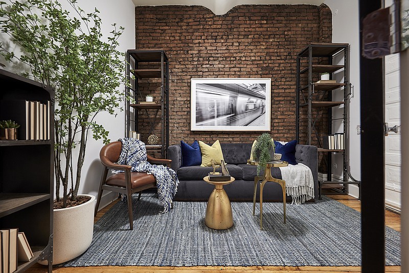 An industrial styled space serves as an office and den in an urban apartment. (Scott Gabriel Morris/TNS)