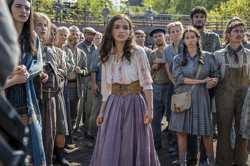 This image released by Lionsgate shows Rachel Zegler, center, in a scene from "The Hunger Games: The Ballad of Songbirds and Snakes." (Lionsgate via AP)