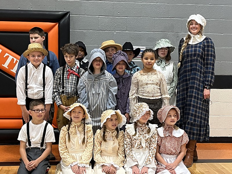 Students dressed in pioneer clothing at New Bloomfield Elementary pose for a photo for the district's annual Pioneer Day. (Fulton Sun photo)