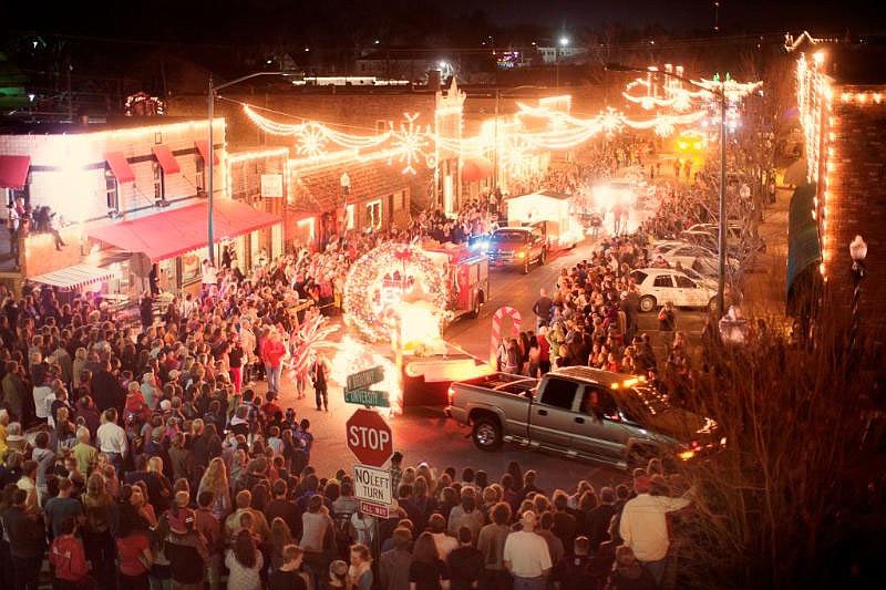Photo submitted Floats turning onto Main Street from University Street dazzle crowds during the annual Light Up Siloam in December of 2022.