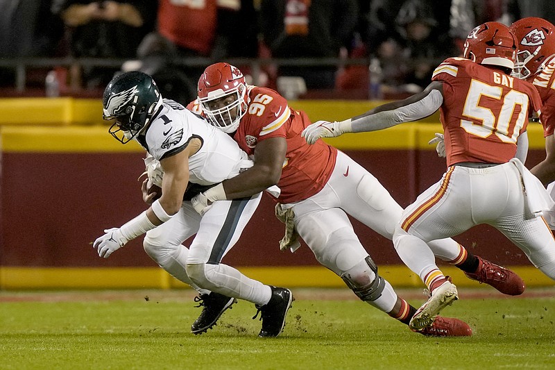 Philadelphia Eagles quarterback Jalen Hurts (1) is sacked by Kansas City Chiefs defensive tackle Chris Jones (95) during the first half of an NFL football game, Monday, Nov. 20, 2023, in Kansas City, Mo. (AP Photo/Charlie Riedel)