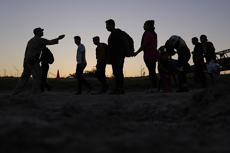 Migrants who crossed the Rio Grande and entered the U.S. from Mexico are lined up for processing by U.S. Customs and Border Protection on Sept. 23, 2023, in Eagle Pass, Texas. As Congress returns this week, Senate Republicans have made it clear they wont support additional war aid for Ukraine unless they can pair it with border security measures. (AP Photo/Eric Gay, File)