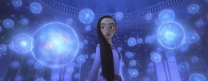 This image released by Disney shows Asha, voiced by Ariana DeBose, in a scene from the animated film &quot;Wish.&quot; (Disney via AP)