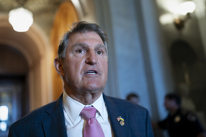 FILE - Sen. Joe Manchin, D-W.Va., speaks outside the chamber, at the Capitol in Washington, June 13, 2023. Manchin announced this month he will not run for reelection next year but will travel the country to consider an independent presidential campaign. (AP Photo/J. Scott Applewhite, File)