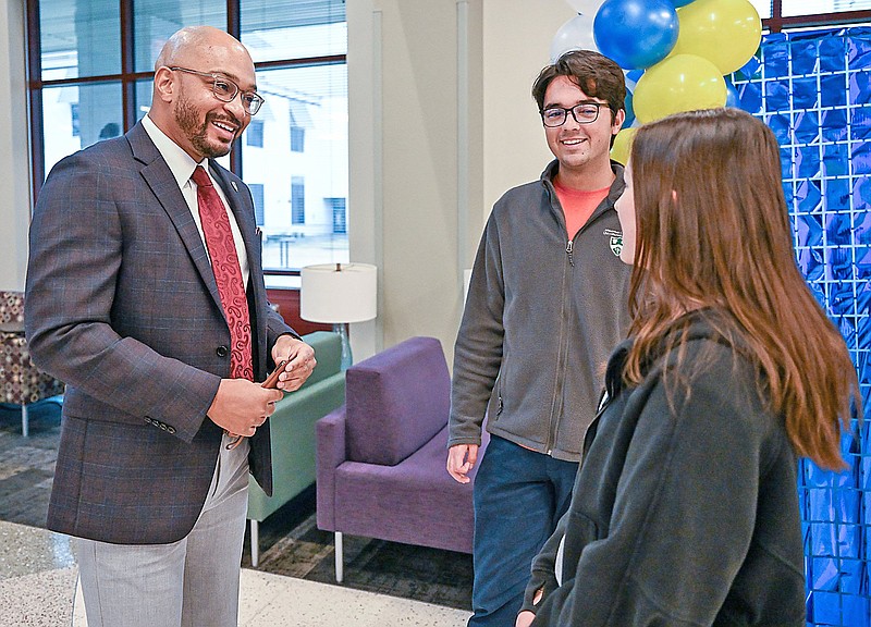 Dr. Christopher Smith (left) speaks with students Cade Winfrey (middle) and Faith Hart (right) on Thursday at the Arkansas College of Health Education in Fort Smith. Smith is the director of diversity, equity, and inclusion for ACHE. Arkansas Tech University (ATU) and the Arkansas College of Health Education have signed an affiliation agreement formalizing a pathway for ATU graduates to continue their studies at ACHE. Visit rivervalleydemocratgazette.com/photo for today's photo gallery.

(River Valley Democrat-Gazette/Caleb Grieger)