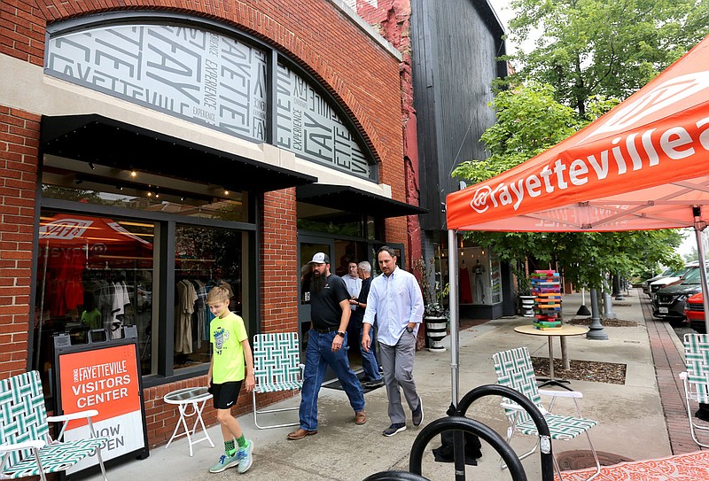 The Experience Fayetteville office is visible in July 2019 on the downtown square in Fayetteville. (File photo/NWA Democrat-Gazette)