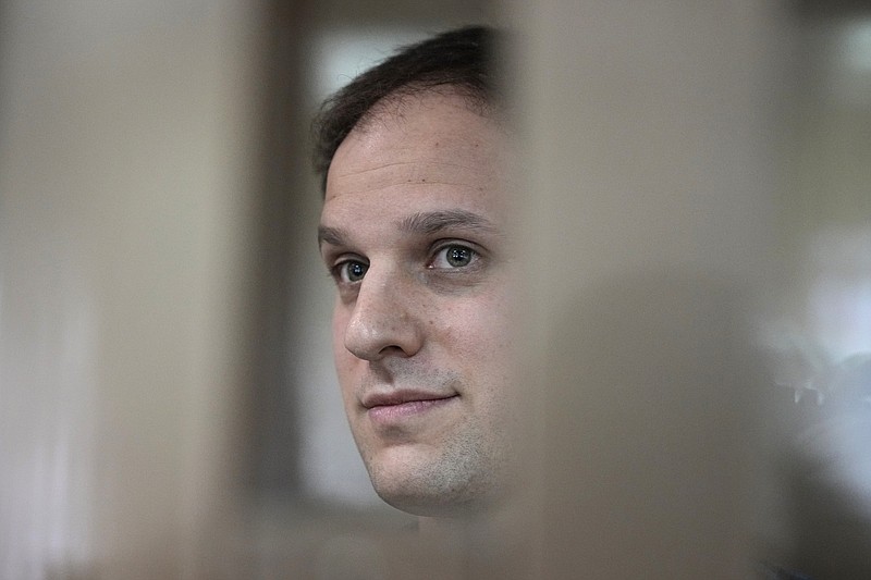 FILE - Wall Street Journal reporter Evan Gershkovich stands in a glass cage in a courtroom at the Moscow City Court in Moscow, Russia, Tuesday, Oct. 10, 2023. A court in Moscow on Tuesday, Nov. 28, extended the detention of Wall Street Journal reporter Gershkovich, arrested on espionage charges, until Jan. 30, Russian news agencies reported.  (AP Photo/Alexander Zemlianichenko, File)