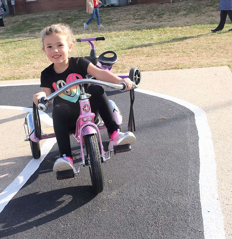 Lynn Kutter/Enterprise-Leader
Rose Wilmoth, a pre-K student at Farmington, rides a tricycle on the pedal track created by students in the EAST program at Farmington Junior High School.