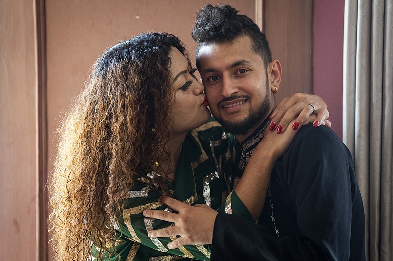 FILE- Same-sex couple Surendra Pandey, right, and Maya Gurung, who got married six years ago, pose for a photograph during an interview with the Associated Press in Kathmandu, Nepal, Thursday, June 29, 2023. The gay couple on Wednesday, Nov. 29, became the first in the nation to receive official same-sex marriage status. The Himalayan nation is one of the first in Asia to allow it. (AP Photo/Niranjan Shrestha, File)