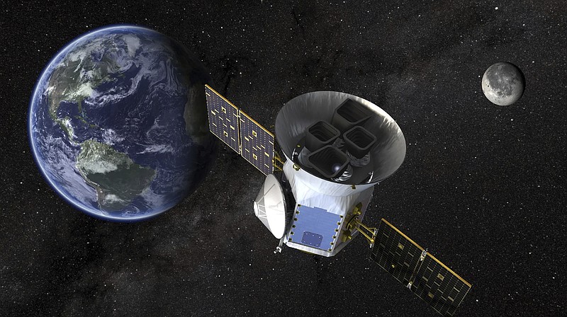 This image provided by NASA shows an artists illustration of the Tess telescope. Astronomers have discovered six planets orbiting a bright nearby star in perfect rhythmic harmony. They say it's a rare, frozen-in-time cosmic wonder that can help explain how solar systems across the galaxy came to be. The compact in-sync system, announced Wednesday, is 100 light-years away. (NASA via AP)