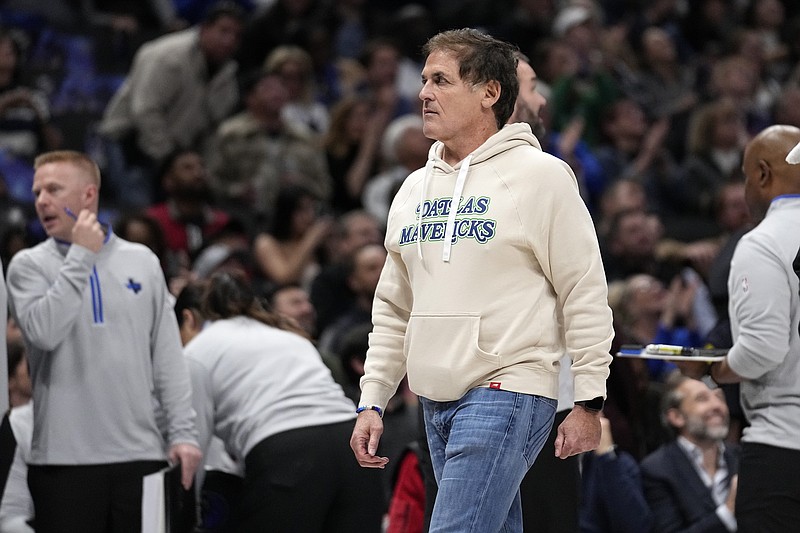 Dallas Mavericks team owner Mark Cuban walks to his seat during the first half of an NBA basketball game against the Houston Rockets in Dallas, Tuesday, Nov. 28, 2023. (AP Photo/Tony Gutierrez)