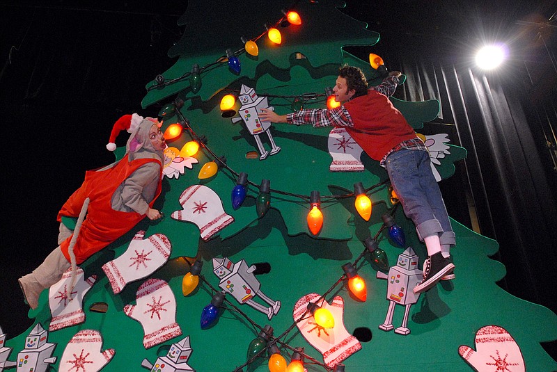 Climbing a 30-foot prop tree, Katie Campbell (left) and Josh Rice rehearse a scene from the Arkansas Arts Center's Children's Theatre production of "Merry Christmas Mouse" Nov. 24, 2009. (Democrat-Gazette file photo)