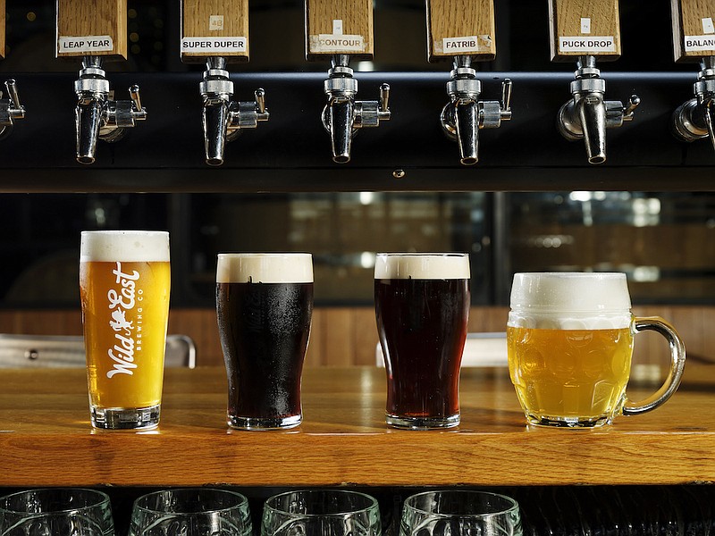 A variety of beer styles are displayed on the bar at Wild East Brewing. From left: a standard draft pour, a nitrogen pour, a cask pour, and a Lukr side tap hladinka pour. MUST CREDIT: Karsten Moran for The Washington Post
