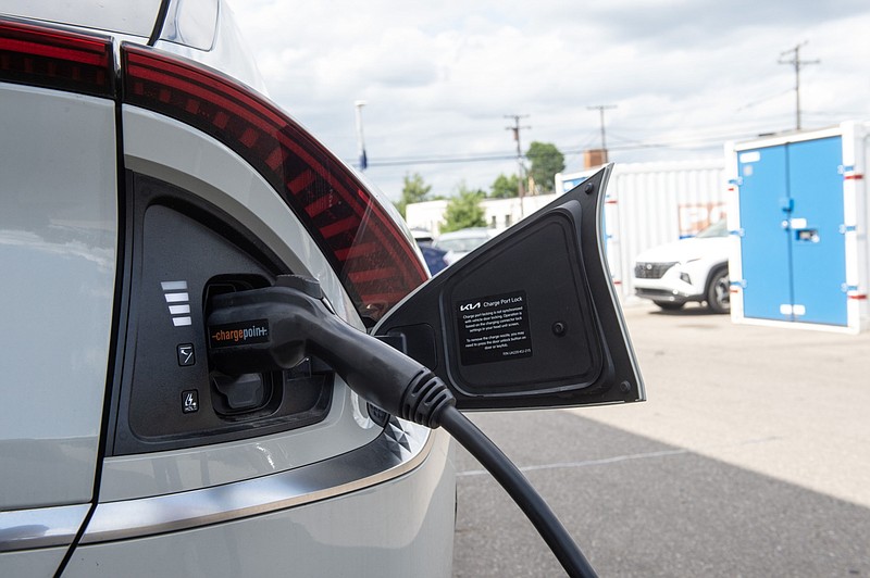 An electric vehicle is charged at a dealership in Detroit. MUST CREDIT: Bloomberg photo by Matthew Hatcher