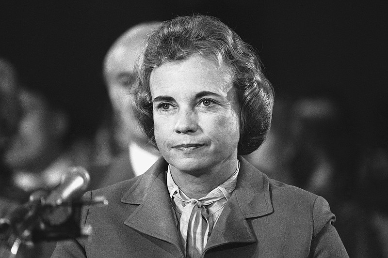 FILE - Judge Sandra Day O'Connor, smiles as she arrives for the start of her confirmation hearings before the Senate Judiciary Committee in Capitol Hill in Washington for the post of Supreme Court Associate Justice, Sept. 9, 1981. O'Connor, who joined the Supreme Court in 1981 as the nation's first female justice, has died at age 93. (AP Photo, File)