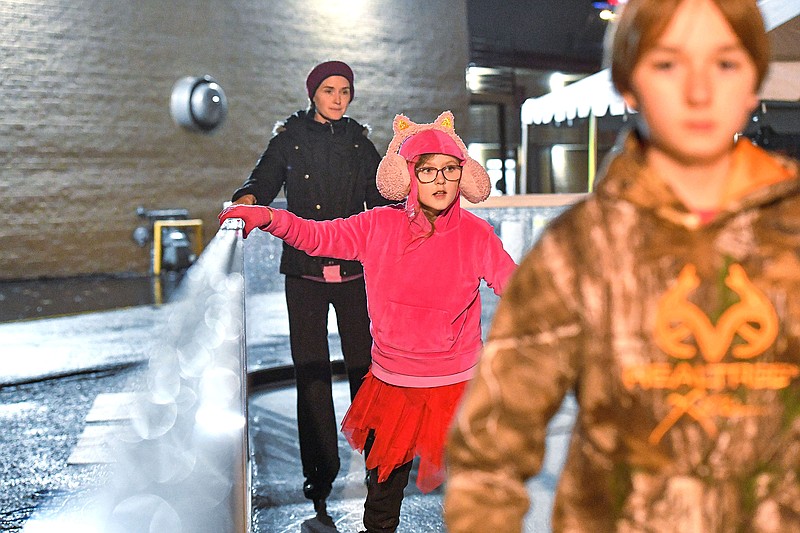 Michaela Schaper (from left), Ariel Schaper and Brandon Schaper ice skate at the Community Rescue Mission ice rink in downtown Fort Smith.

(River Valley Democrat-Gazette File Photo/Hank Layton)