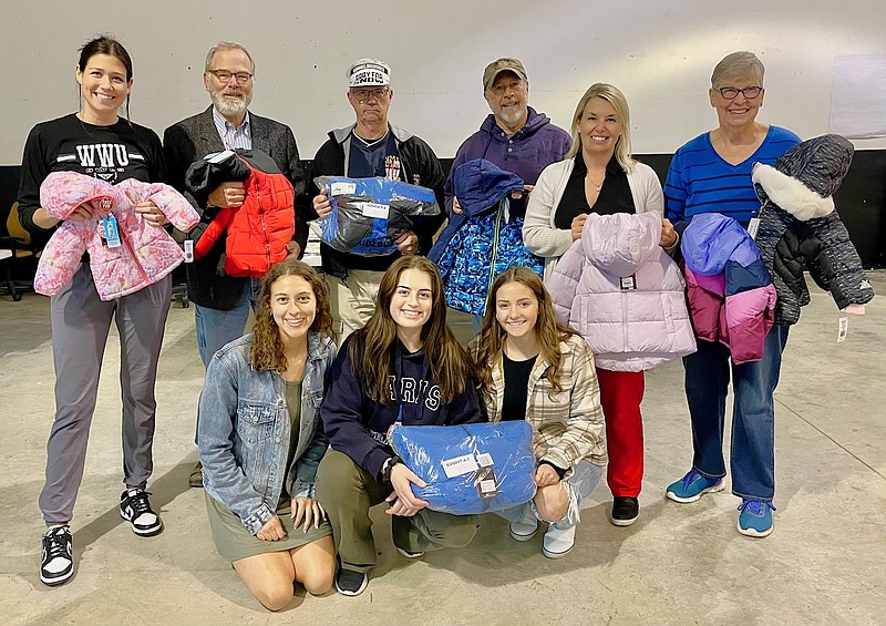 Submitted photo
Fulton Rotary members and William Woods Rotaract members holding coats collected through Coats for Callaway Kids. The coats will be distributed through SERVE on its Adopt-a-Family distribution day.
Back row, left to right: Haley Gilmore, Bob Sterner, Whit McCoskrie, Bob Hansen, Amanda Gowin, Mary Ann Beahon.
Front row, left to right: Crystal Ruden, Anna Paul, Caroline McCurren.