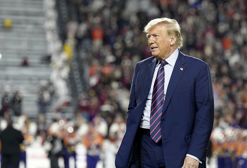 Republican presidential candidate and former President Donald Trump stands on the field during halftime in an NCAA college football game between the University of South Carolina and Clemson Saturday, Nov. 25, 2023, in Columbia, S.C. (AP Photo/Meg Kinnard)