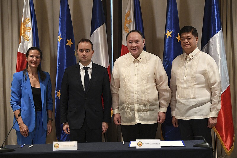 From left, French ambassador to the Philippines Marie Fontanrl, French Minister for the Armed Forces Sebastien Lecornu, Philippine Secretary of National Defense Gilberto Teodoro, and Philippine under Secretary of National Defense Irineo Espino pose for photo prior to a joint press conference at a hotel in Manila, Philippines on Saturday Dec. 2, 2023. (Ted Aljibe/Pool Photo via AP)