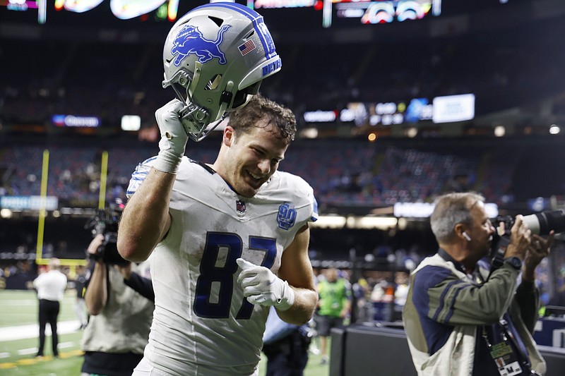 Detroit Lions tight end Sam LaPorta (87) acknowledges the fans after an NFL football game against the New Orleans Saints, Sunday, Dec. 3, 2023, in New Orleans. Detroit won 33-28. (AP Photo/Butch Dill)