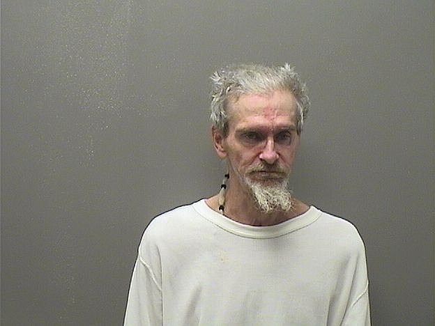 Man allegedly passed out in vehicle arrested for drugs, illegal weapons ...