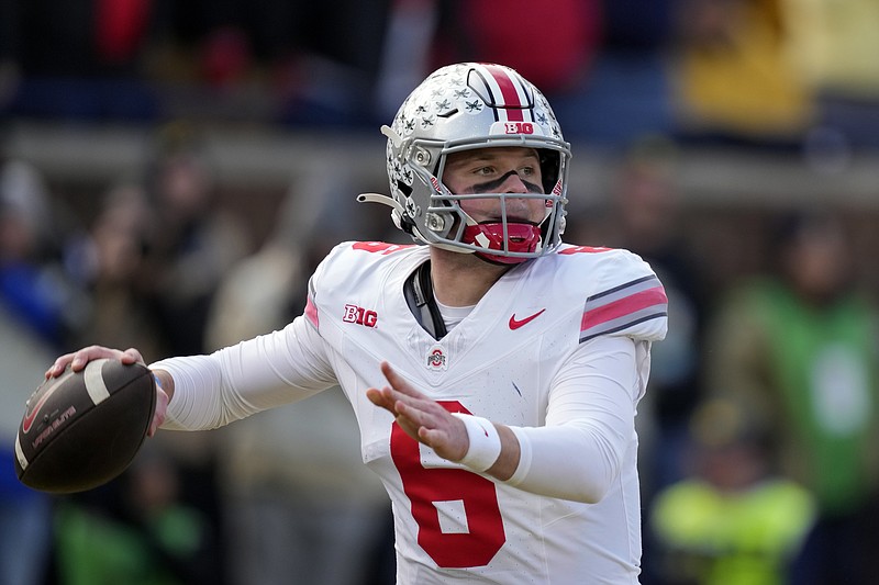 Ohio State quarterback Kyle McCord throws during the first half of an NCAA college football game against Michigan, Saturday, Nov. 25, 2023, in Ann Arbor, Mich. (AP Photo/Carlos Osorio)