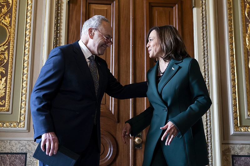 Senate Majority Leader Sen. Chuck Schumer, D-N.Y., talks with Vice President Kamala Harris after presenting Harris with a golden gavel after she cast the 32nd tie-breaking vote in the Senate, the most ever cast by a vice president, Tuesday, Dec. 5, 2023, on Capitol Hill in Washington. (AP Photo/Stephanie Scarbrough)