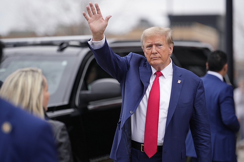 Former President Donald Trump waves to a crowd as he leaves a Commit to Caucus rally, Saturday, Dec. 2, 2023, in Ankeny, Iowa. (AP Photo/Matthew Putney)