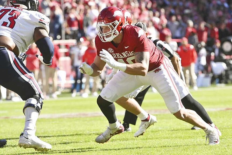 Arkansas defensive lineman Landon Jackson of Texarkana, Texas, looks to get through the line against Liberty on Saturday, Nov. 5, 2022, in Fayetteville, Ark. (AP Photo/Michael Woods)