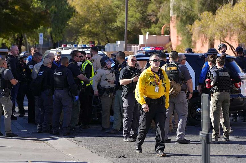 Las Vegas Metro Police respond to a shooting reported on the University of Nevada, Las Vegas, campus, Wednesday, Dec. 6, 2023, in Las Vegas. (AP Photo/Lucas Peltier)