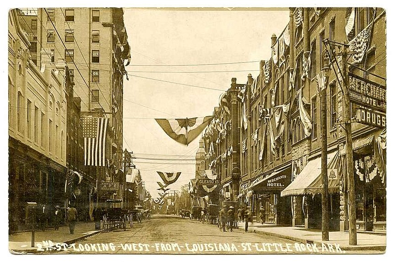 Little Rock, 1911: During the United Confederate Veterans Reunion, the photographer pointed his camera west down Second Street from its intersection with Louisiana Street. On the right is the budget-level Merchants Hotel during a week in which every room in town was booked.

Send questions or comments to Arkansas Postcard Past, P.O. Box 2221, Little Rock, AR 72203