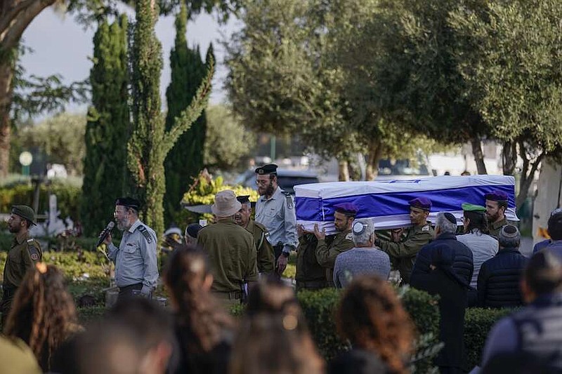 Israeli soldiers carry the coffin of reservist Master Sgt. Gil Daniels during his funeral in Ashdod, Israel, Wednesday, Dec. 6, 2023. Daniels was killed in Gaza during an Israeli military ground offensive against the enclave's militant Hamas rulers. (AP Photo/Leo Correa)