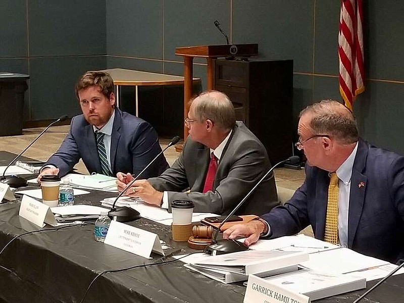 Then-State Treasurer Scott Fitzpatrick, left, defended accelerating redemptions of low income housing tax credits during a September 2021 meeting of the Missouri Housing Development Commission while Commissioner Mark Eliff, center, and Lt. Gov. Mike Kehoe, commission chairman, listen (Rudi Keller/Missouri Independent).