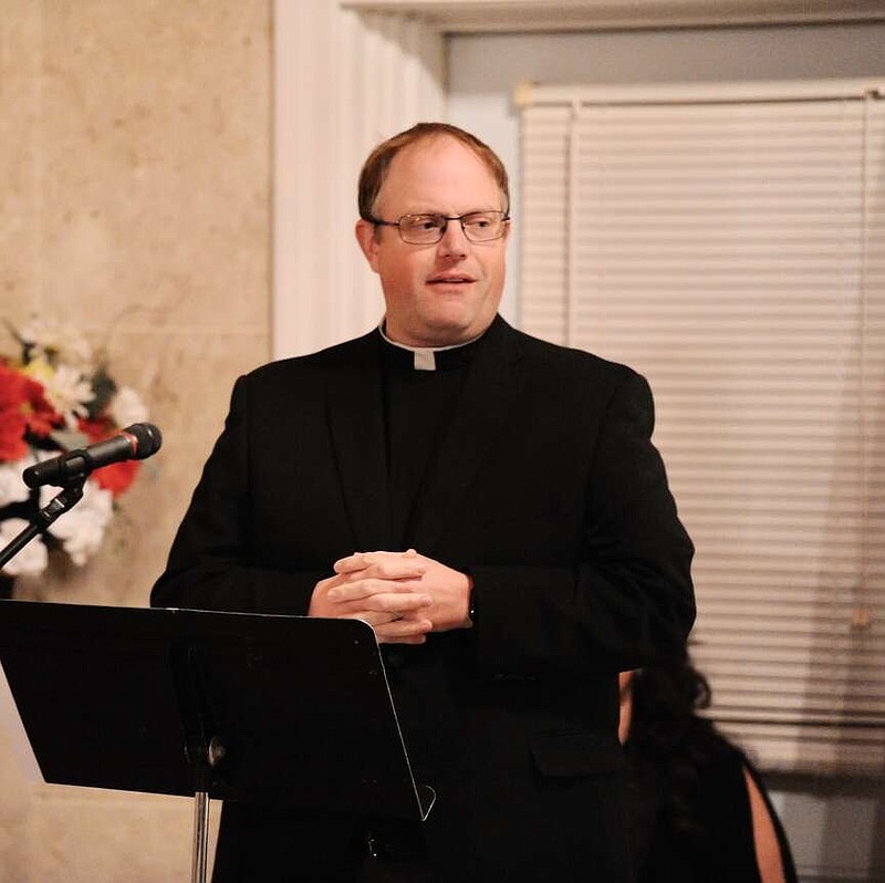 Joe Gamm/News Tribune
The Rev. Sam Powell, associate pastor at Trinity Lutheran Church, offers words of hope and healing for families of people who passed in 2023. Powell spoke Thursday night at the annual Hawthorn Memorial Gardens Luminary & Christmas Remembrance Service.