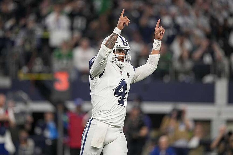 Dallas Cowboys quarterback Dak Prescott reacts after a play against the Philadelphia Eagles during the first half of an NFL football game, Sunday, Dec. 10, 2023, in Arlington, Texas. (AP Photo/Tony Gutierrez)
