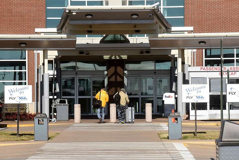 Passengers head into the terminal Nov. 25, 2021, at Northwest Arkansas National Airport.
(File Photo/NWA Democrat-Gazette/Flip Putthoff)