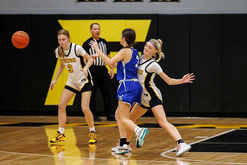 Fulton's Aubrey Fleetwood receives contact from Boonville's Karagyn Cooper as they fight for the ball Tuesday at Fulton High School in Fulton. Boonville won its 11th straight game against the Hornets. (Shawley Photography/Courtesy)