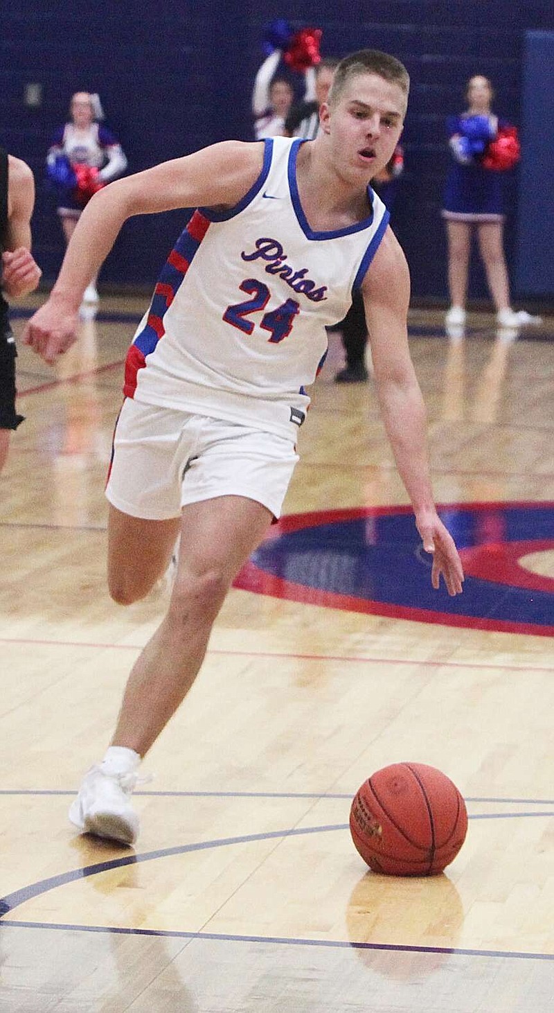 Democrat photo/Evan Holmes — Gavin Porter comes up with a steal and a breakaway score as part of a 15-0 run to open Friday's game against the Southern Boone Eagles.