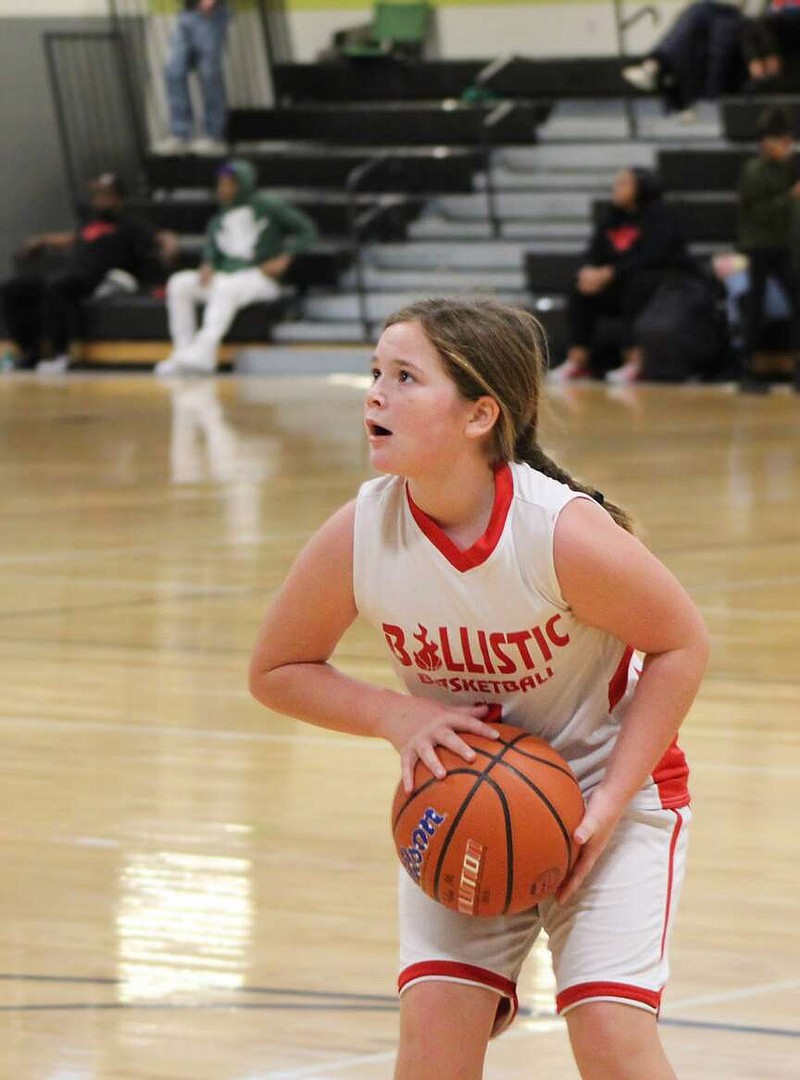 Alexa Pfeiffer/News Tribune photo: 
Emma Cotten gets ready to put up a shot Saturday, Dec. 16, 2023, during the Hoops Midwest Basketball Tournament at The LINC. Emma is on the Ballistic team made up of fourth-grade girls from California.