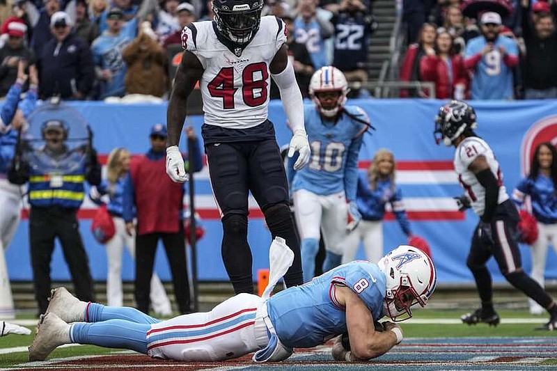 Tennessee Titans quarterback Will Levis (8) falls into the end zone for a touchdown against the Houston Texans during the first half of an NFL football game, Sunday, Dec. 17, 2023, in Nashville, Tenn. (AP Photo/George Walker IV)